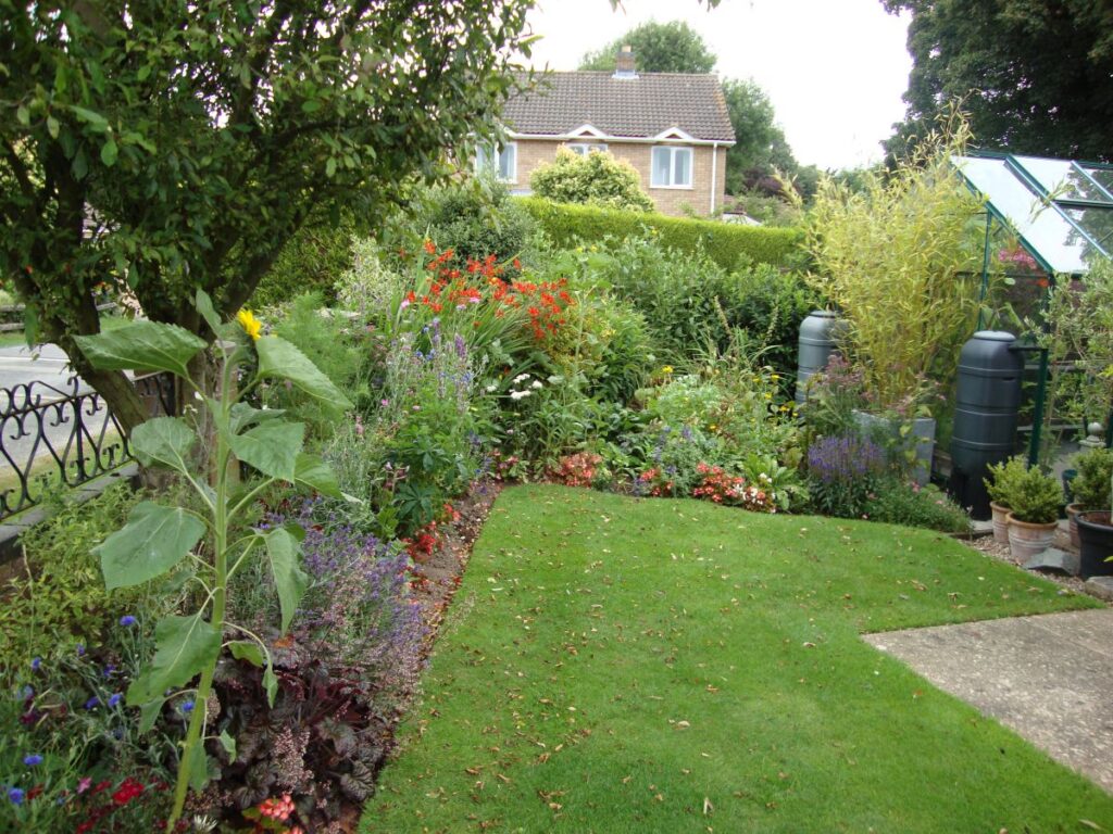 Class 4 Private Houses - Gardens visible from the road. WINNER