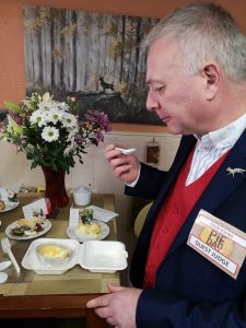 Guest Judge Colin Young tests the pies in the Toadstool Cafe on Queen Street