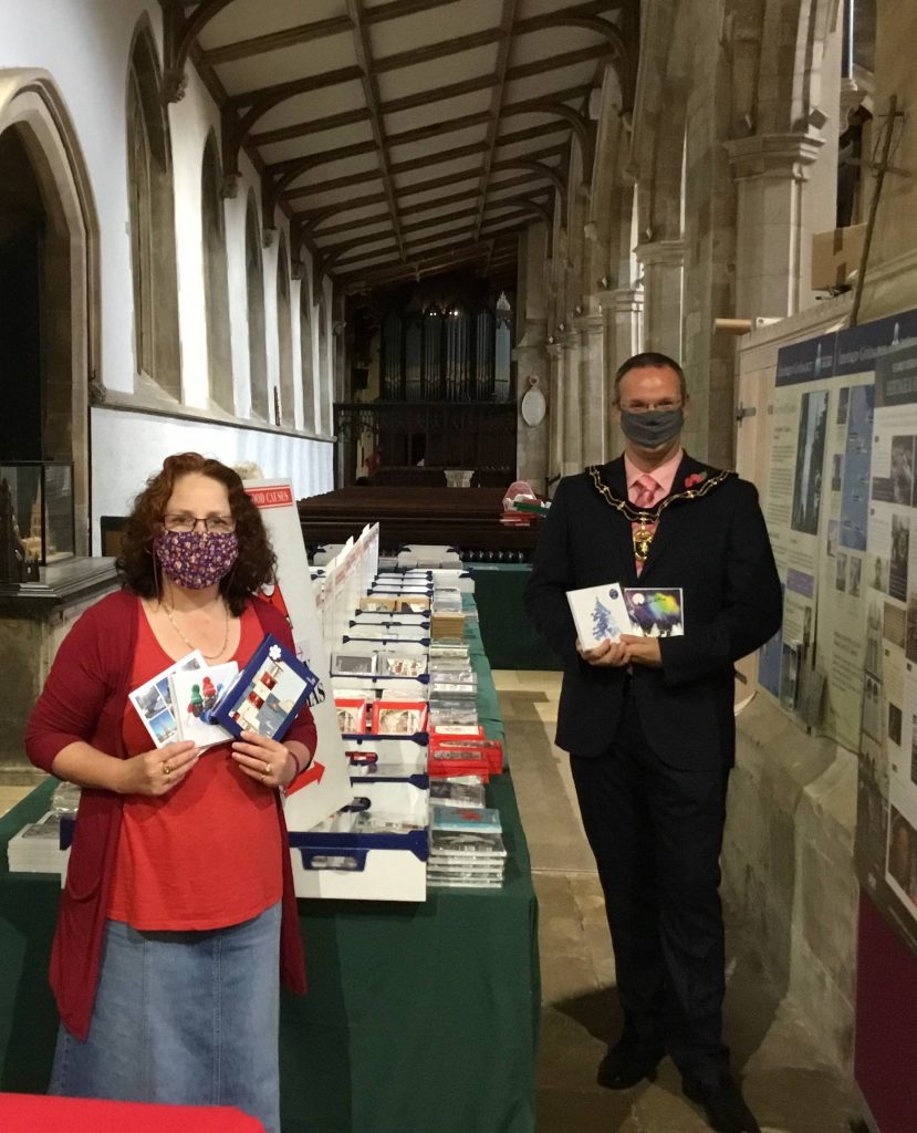 Mayor opening charity christmas cards at St James Church